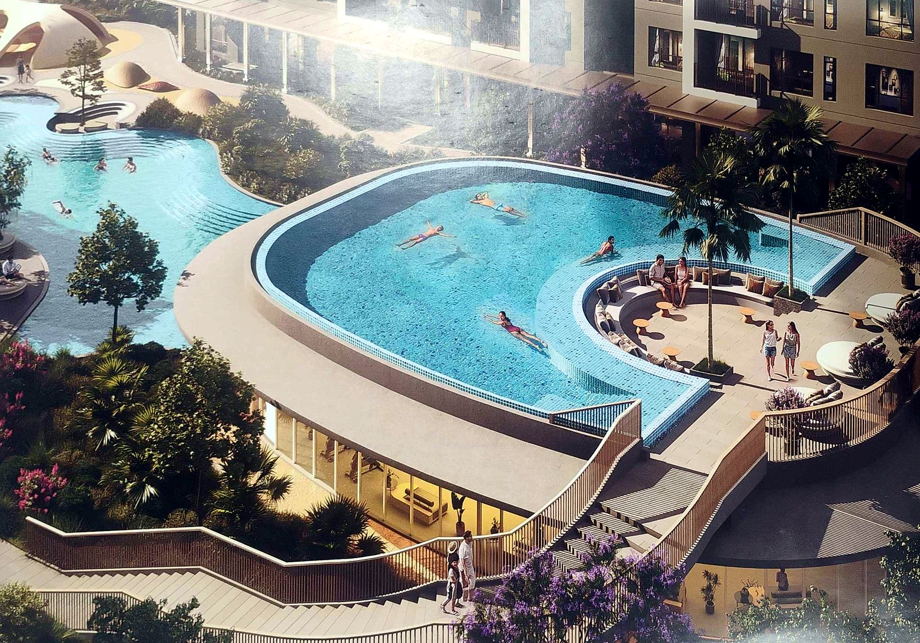 Cascading pool deck with sunken seating overlooking a lagoon pool